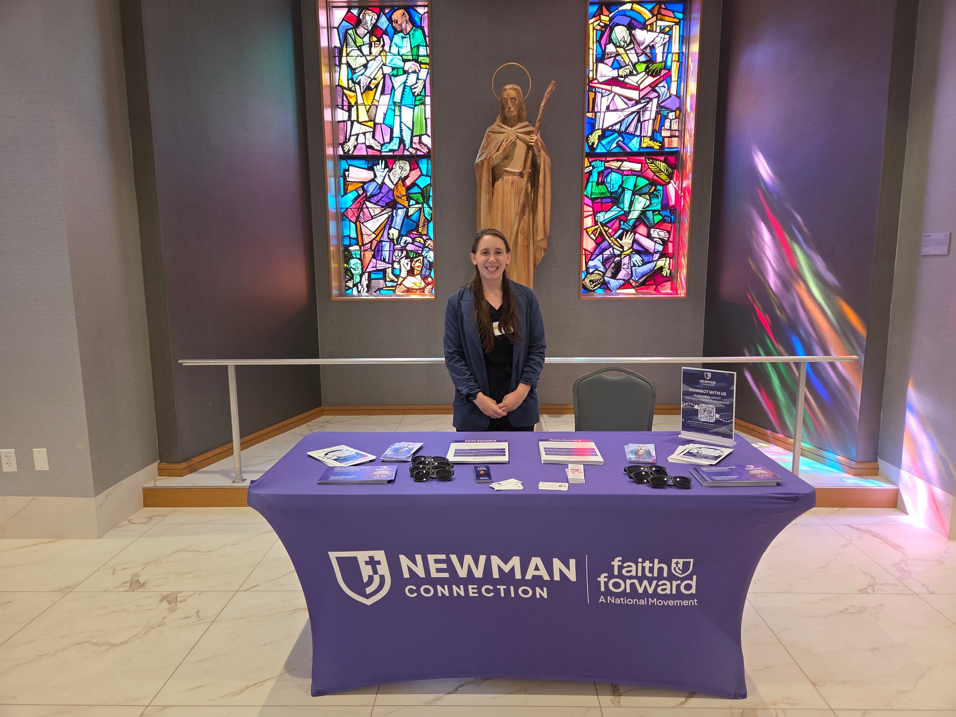 mary at the Newman Connection table
