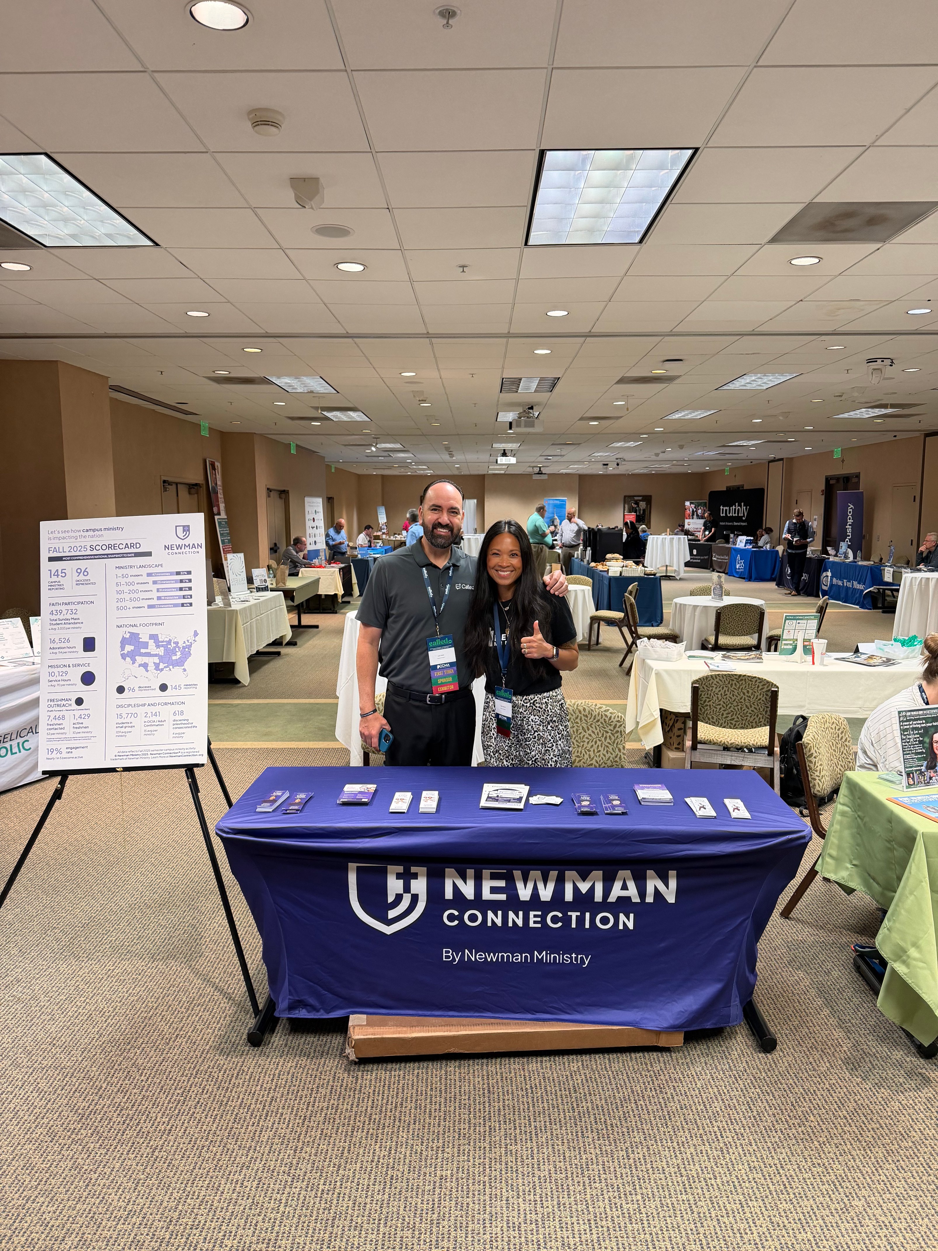 Juan and Patti at Newman Connection's CCMA26 table